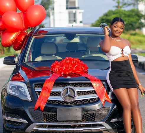 Naira Marley’s Sister, Shubomi Officially Unveils Her Newly-Acquired Benz worth over N13 Million