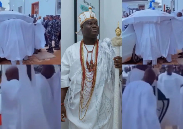 Netizens reacts trail video of the Ooni of Ife being covered by his palace chiefs as he exits his car